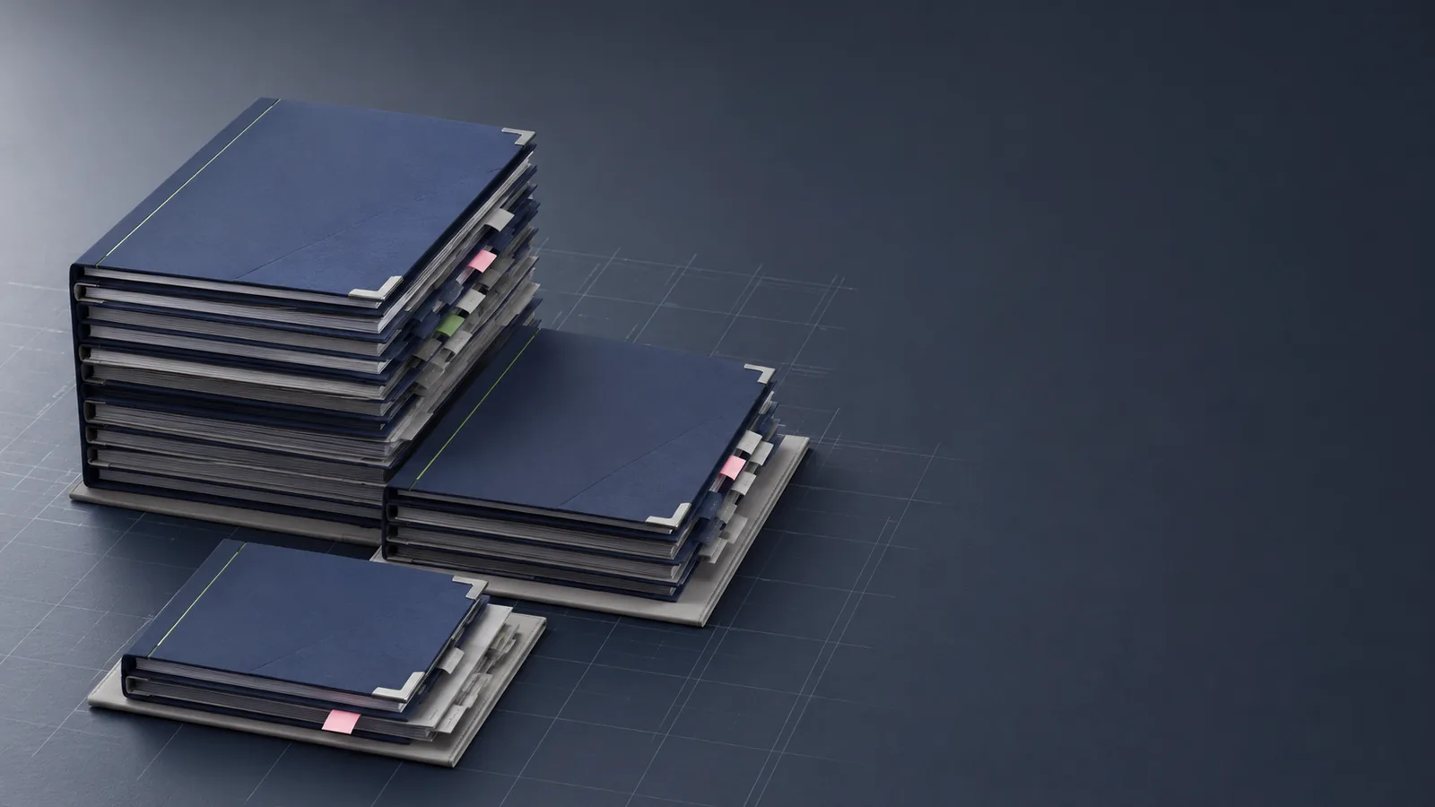 Three stacks of navy document binders arranged in descending tiers, representing the bronze, silver, and gold deployment packages