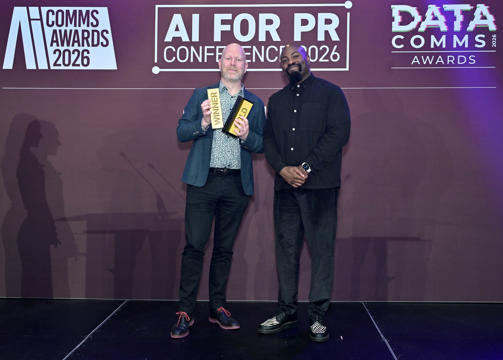 Michael MacLennan accepting the awards at the inaugural AI Comms Awards 2026, where Comms With AI won Gold for Best Innovation in AI Tools for Communications
